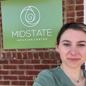 Selfie in front of Midstate Infusion Center Sign