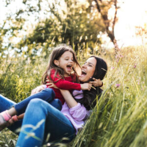 Mother and Daughter playing in Field